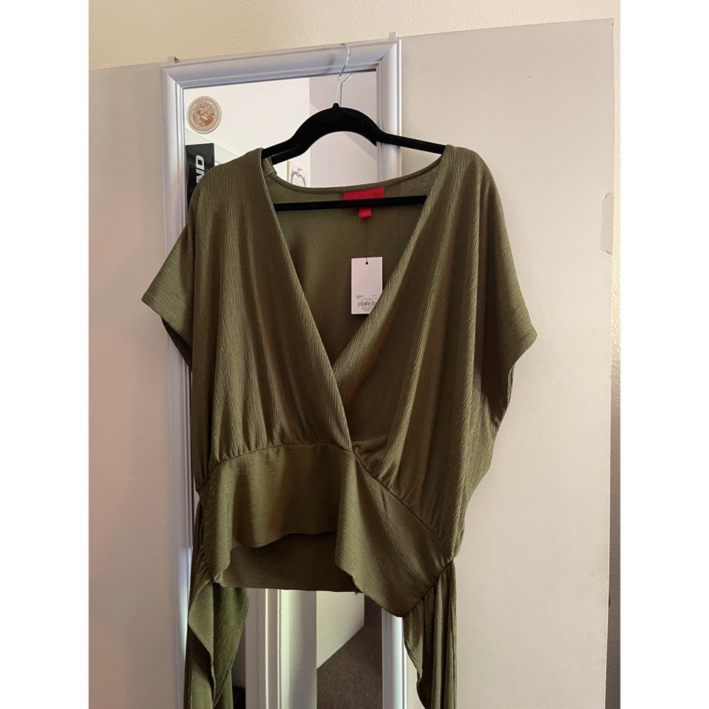 Olive green cross body front with tie in back.